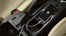 A cell phone in center console pairing to Bluetooth®.